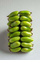 Stack of fresh green bananas, white background