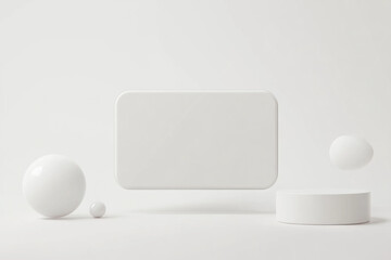 White table displaying three spheres and white square, minimalist decor.