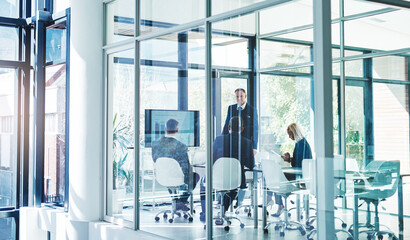 Wall Mural - Meeting, presentation and business people in office for statistics, teamwork and collaboration. Corporate, company and men and women in glass boardroom for feedback, planning and financial review