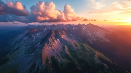 Wall Mural - golden hour illuminates a vast valley with dramatic clouds in the mountains during sunset