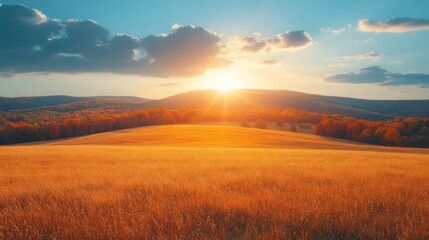 The sun rises above gentle hills, casting a warm golden glow over a serene field. Autumn colors paint the landscape, with vibrant trees reflecting the light.