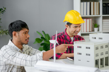 Wall Mural - two architects are discussing the design of a sustainable building, focusing on renewable energy sol