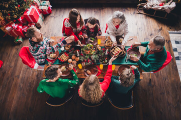 Wall Mural - Above view full body portrait of peaceful big family table eat enjoy celebrate new year xmas flat indoors