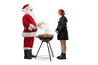 © Ljupco Smokovski - Santa claus and a young woman grilling meat on a bbq