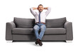 © Ljupco Smokovski - Businessman stretching and relaxing on a sofa