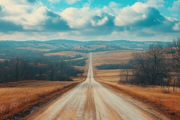 Wall Mural - A Long, Winding Dirt Road Leading Through Rolling Hills