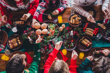 Wall Mural - Above view cropped portrait of peaceful big family eat food table enjoy celebrate new year xmas flat indoors