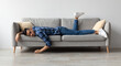 © Prostock-studio - Lack of Energy Concept. Full Body Length Of Exhausted Sleepless Young Man Lying On The Couch With Face Down, Tired In The End Of Hard Working Day, Fatigued Middle Eastern Male Resting At Home