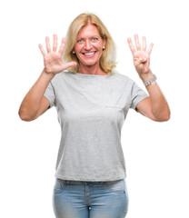 Wall Mural - Middle age blonde woman over isolated background showing and pointing up with fingers number nine while smiling confident and happy.