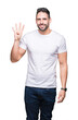 © Krakenimages.com - Young man wearing casual white t-shirt over isolated background showing and pointing up with fingers number four while smiling confident and happy.