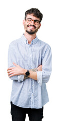 Wall Mural - Young handsome man wearing glasses over isolated background happy face smiling with crossed arms looking at the camera. Positive person.