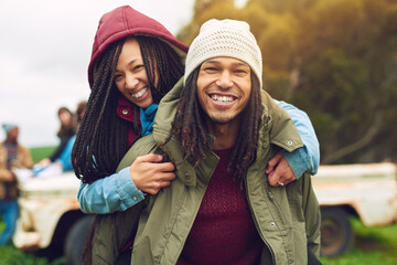 Poster - Smile, african couple portrait and piggyback in park, bonding and fun on holiday with winter date. Happy, man and woman with vacation for love, care and freedom in nature, forest or woods travel