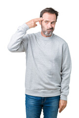 Wall Mural - Handsome middle age senior man wearing a sweatshirt over isolated background Shooting and killing oneself pointing hand and fingers to head, suicide gesture.