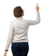 © Krakenimages.com - Young beautiful african american woman wearing glasses over isolated background Posing backwards pointing behind with finger hand