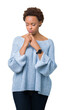 © Krakenimages.com - Young beautiful african american woman wearing a sweater over isolated background depressed and worry for distress, crying angry and afraid. Sad expression.