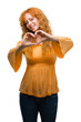 © Krakenimages.com - Young redhead woman smiling in love showing heart symbol and shape with hands. Romantic concept.