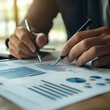 © Zahra - Businessman, finance analyst analyzing financial report and economic growth graph chart. Business strategy. planning and solution, budget management, business success, finance investment background