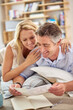 © ArcursForPI/peopleimages.com - Photographs, memory and mature couple in home with remembrance for bonding, care or connection. Happy, love and man and woman with pictures for nostalgia or reminiscing together for marriage at house