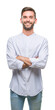© Krakenimages.com - Young handsome man over isolated background happy face smiling with crossed arms looking at the camera. Positive person.