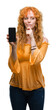 © Krakenimages.com - Young redhead woman showing smartphone serious face thinking about question, very confused idea