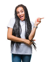 Wall Mural - Young braided hair african american girl over isolated background with a big smile on face, pointing with hand and finger to the side looking at the camera.