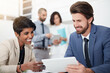 © ThurstanJam/peopleimages.com - Meeting, ideas and happy with tablet, people and conversation for financial report and confident. Collaboration, teamwork and paperwork for corporate, talking and project for actuary and boardroom