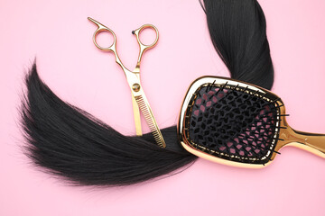 Poster - Black hair strand, brush and professional scissors on pink background, top view