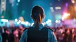 © sirisakboakaew - A female security guard managing a crowd during a public event, keeping the atmosphere safe and organized