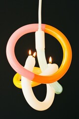 Aufkleber - Contemporary Neon Menorah Sculpture with Vibrant Colors against Black Background