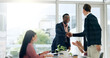 © peopleimages.com - Business people, meeting or smile with handshake in office for welcome, b2b collaboration or contract success. Professional, employees or shaking hands with applause for agreement or partnership deal