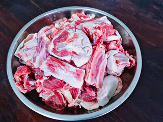 Lamb ribs in stainless steel bowl