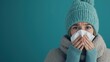 © David - A girl dressed in a knitted hat and scarf holds a tissue to her nose, looking sick and uncomfortable. The soft winter clothes and teal background highlight the cold and flu theme,