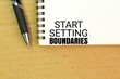 © Fauzi - pen and book with the words Start setting boundaries. essential for maintaining healthy relationships and personal well-being.