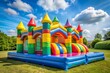 © Евгений Порохин - A colorful inflatable castle with a rainbow roof