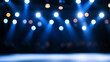 © Nakarin - Bright spotlights illuminate runway, creating vibrant atmosphere perfect for fashion show. blue tones and soft bokeh effect enhance excitement of event
