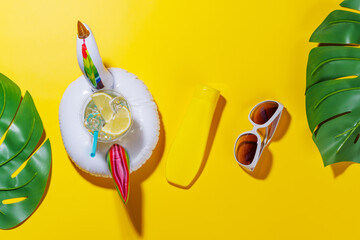 Poster - A vibrant summer vacation scene with flip flops, shades, and a floating flamingo