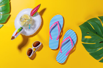Poster - A vibrant summer vacation scene with flip flops, shades, and a floating flamingo