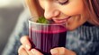 © upnowgraphics - Woman Smelling Beetroot Juice with a Smile