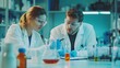© irawan - Two Scientists Working in a Lab, Examining a Chemical Sample