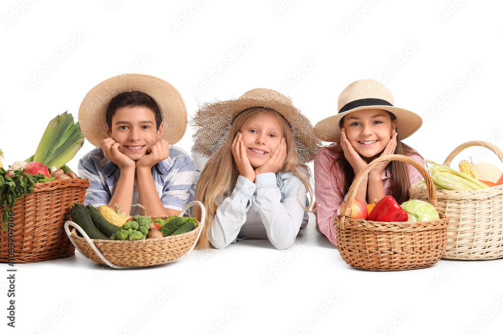 Little farmers with fresh food lying on white background