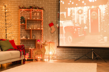 Canvas Print - Interior of living room with Christmas lights, sofa and projector screen