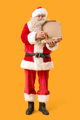 Poster - Santa Claus tasty pizza on yellow background