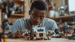 © irawan - A Young Man Concentrated on Building a Toy Robot