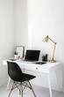 © Montaha Hossain - Minimalist Home Office Desk Setup with White Desk and Black Chair