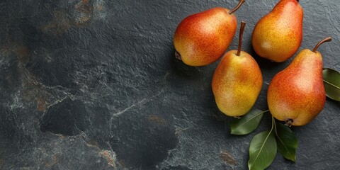 Aufkleber - Fresh pears on a black stone surface. Fruits. Free space for text. Top view.