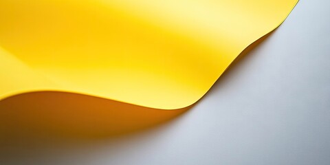 Leinwandbilder - Close-up view of a yellow sheet of paper on a gray background.