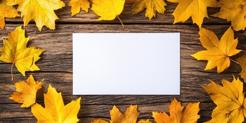 Aufkleber - Yellow leaves on a wooden background in autumn with white paper for copy space, colorful mock-up.