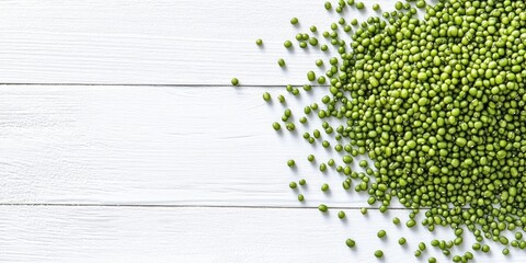 Poster - Raw green mung beans on a white wooden background, top view. Copy space.