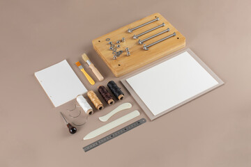 Scrapbooking kit with threads brushes and cutting tools