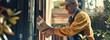 © carballo - delivery man delivering a package at home